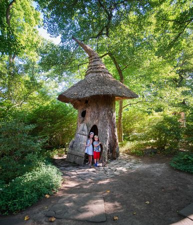 Two children at the “Faerie Cottage” folly at the Winterthur Museum, Winterthur, Delaware