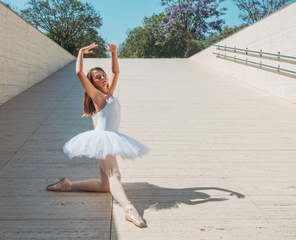 Ballerina performing classical position outside