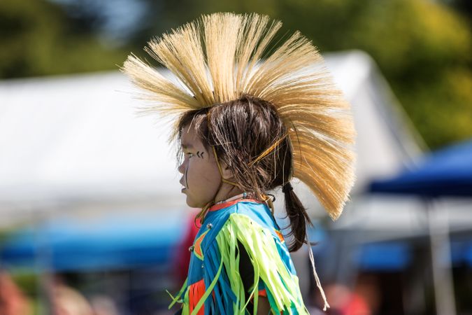 Red Wing, MN, USA - September 22nd, 2017: Native American girl in traditional headdress