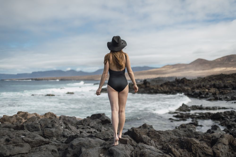 Sensual female near stormy sea