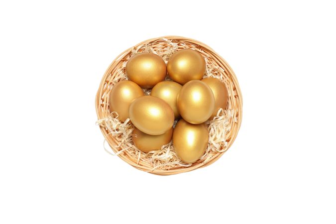 Concept of wealth and retirement - golden eggs, isolated on light background