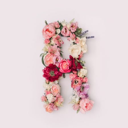 Letter R made of real natural flowers and leaves