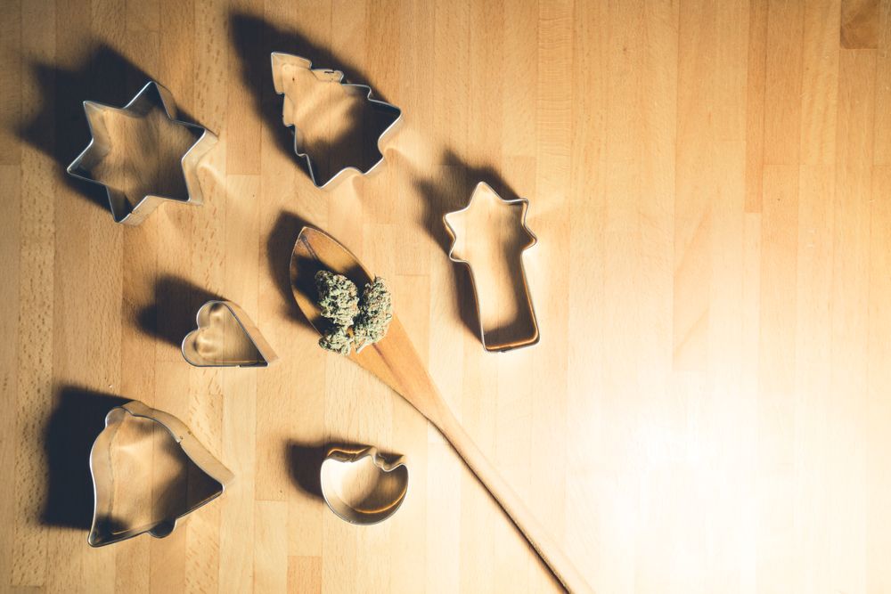 Spatula with dried marijuana and cookie cutters