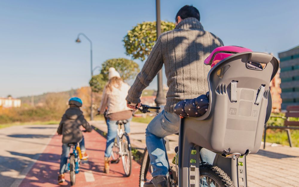 Back of family of 4 on bike ride together