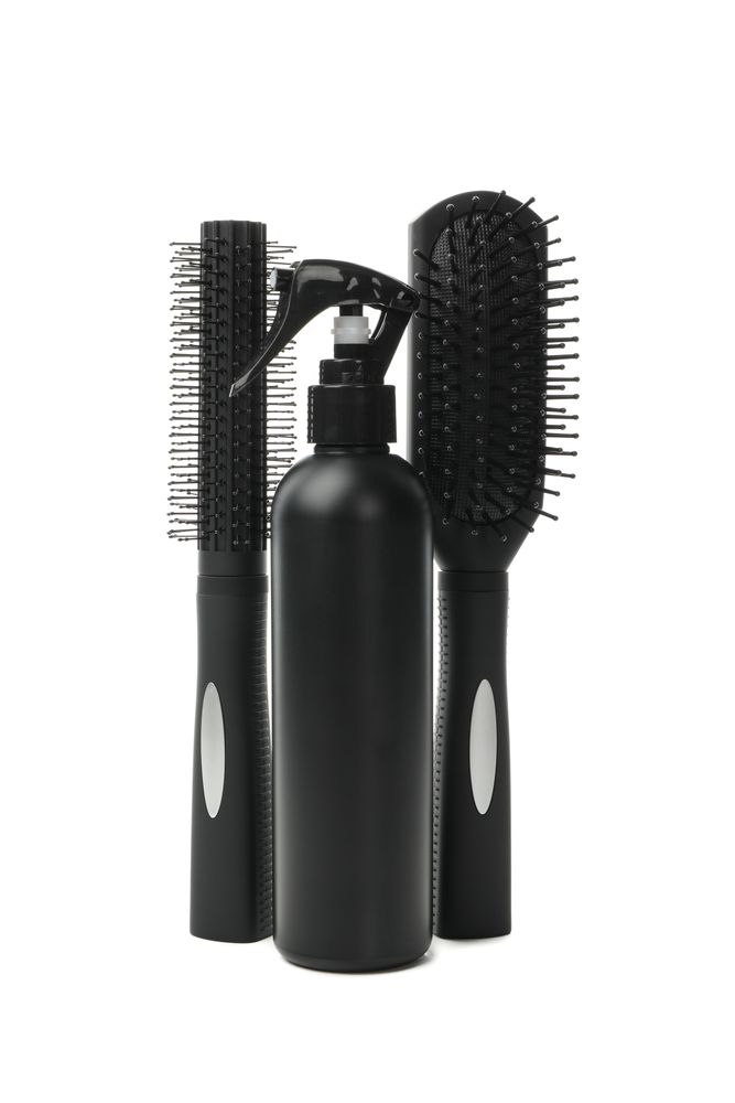 Different hairdresser accessories isolated on blank background
