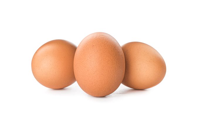 Brown chicken eggs isolated on plain background