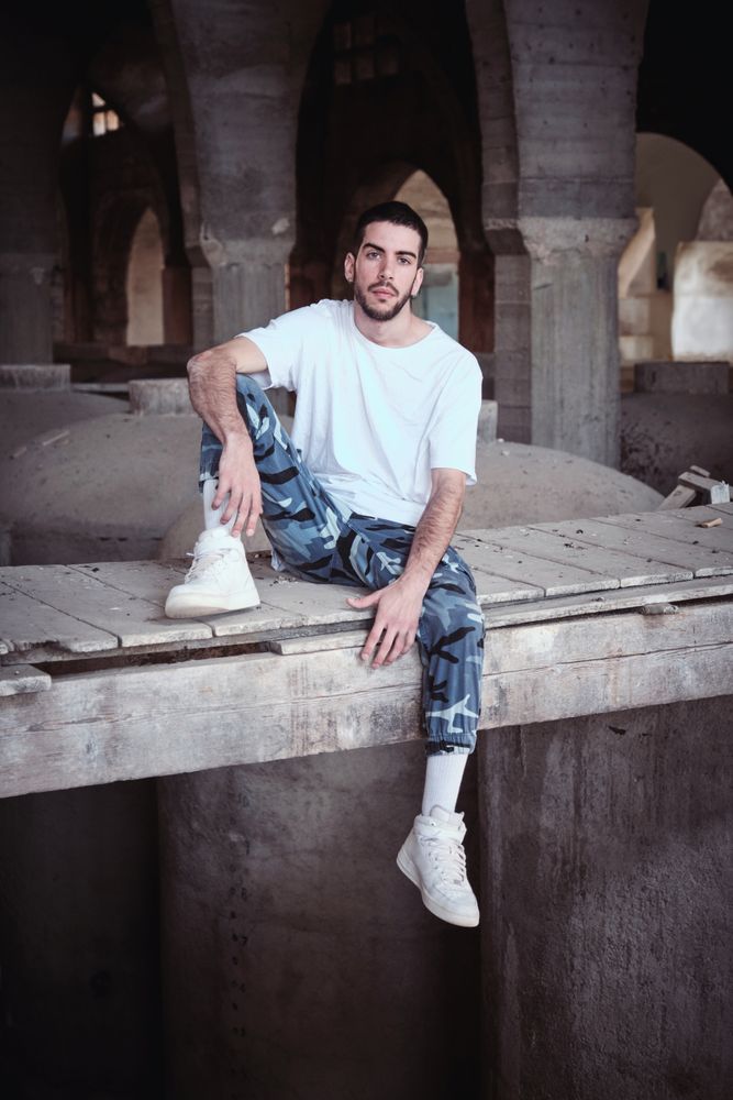Confident man in neglected industrial facility