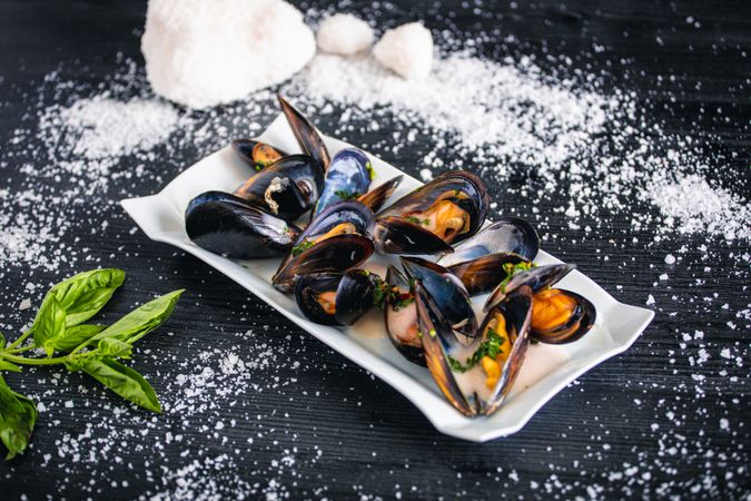 Steamed mussels with Thai sauce in plate