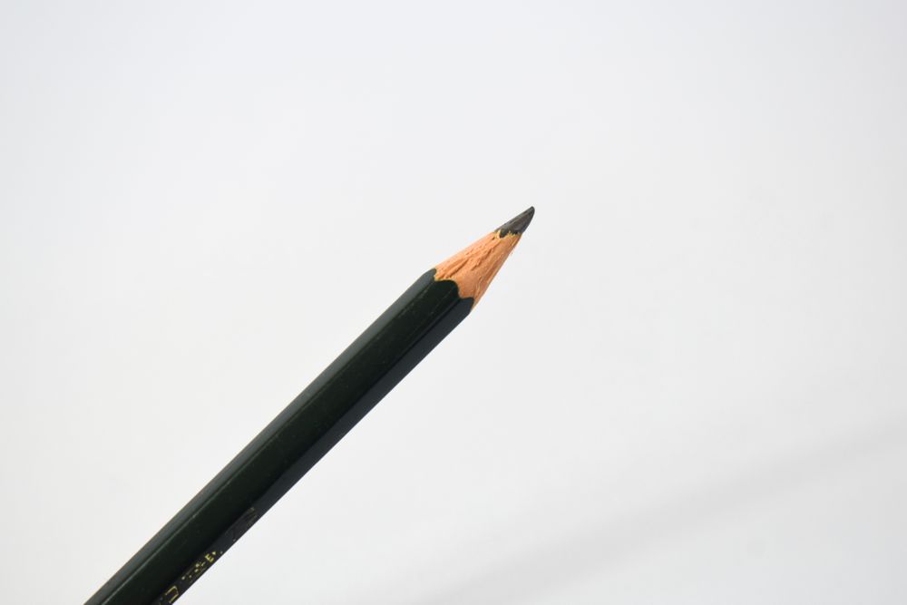Sharpened pencil diagonally across picture with copy space