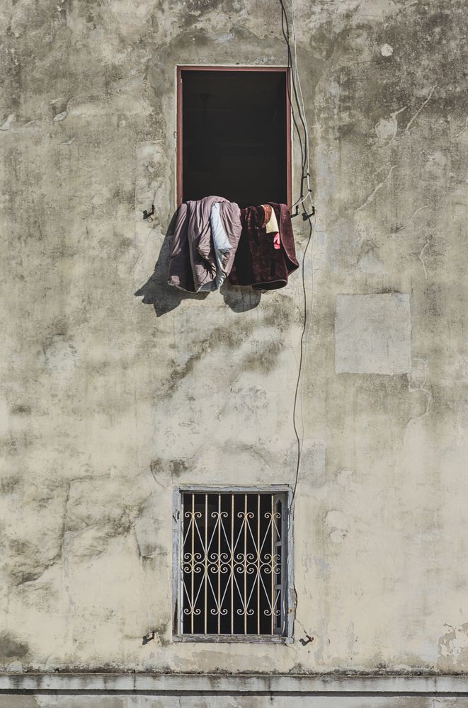 Cloths hanging and drying from window