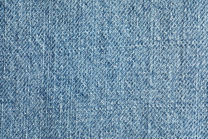 Texture of blue jeans as background, space for text