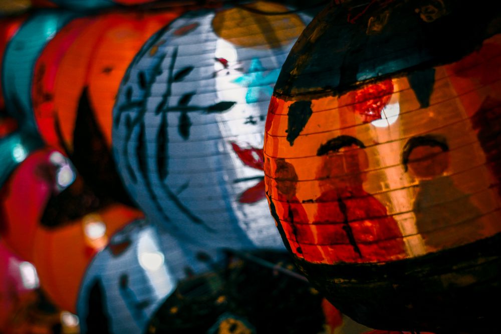 Red and blue lit lanterns in close-up
