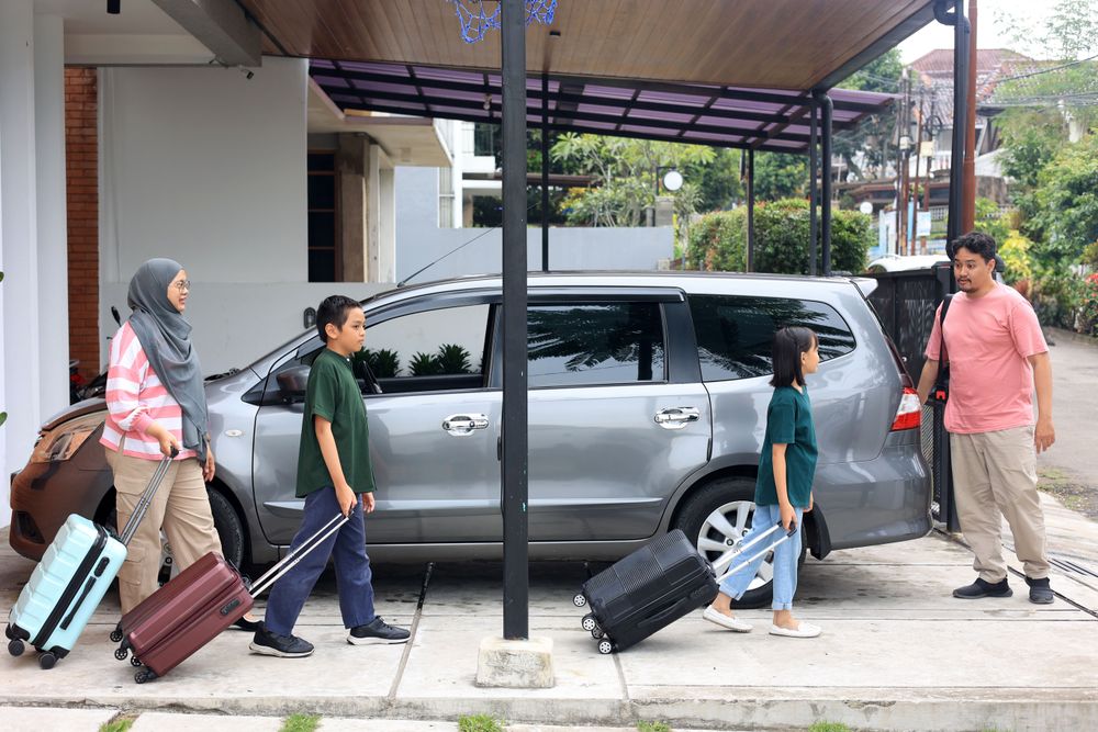 Happy Asian Muslim Family Going on Mudik Road Trip Back Home During Eid Mubarak Celebration