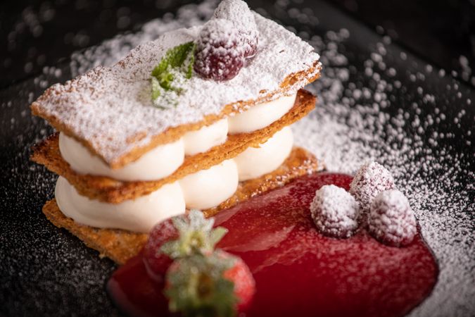 Diphlomate cream and red fruit strudel in elegant plate