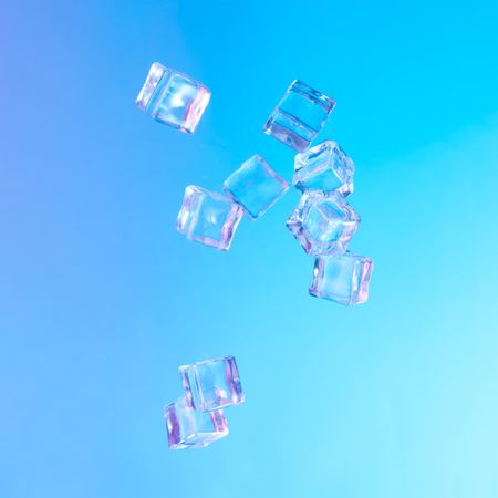 Ice cubes in vibrant bold gradient purple and blue holographic color lights