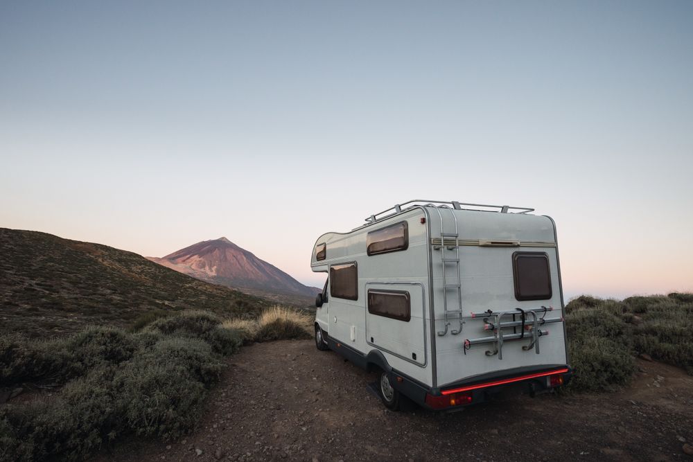 Camper parked in desert landscape