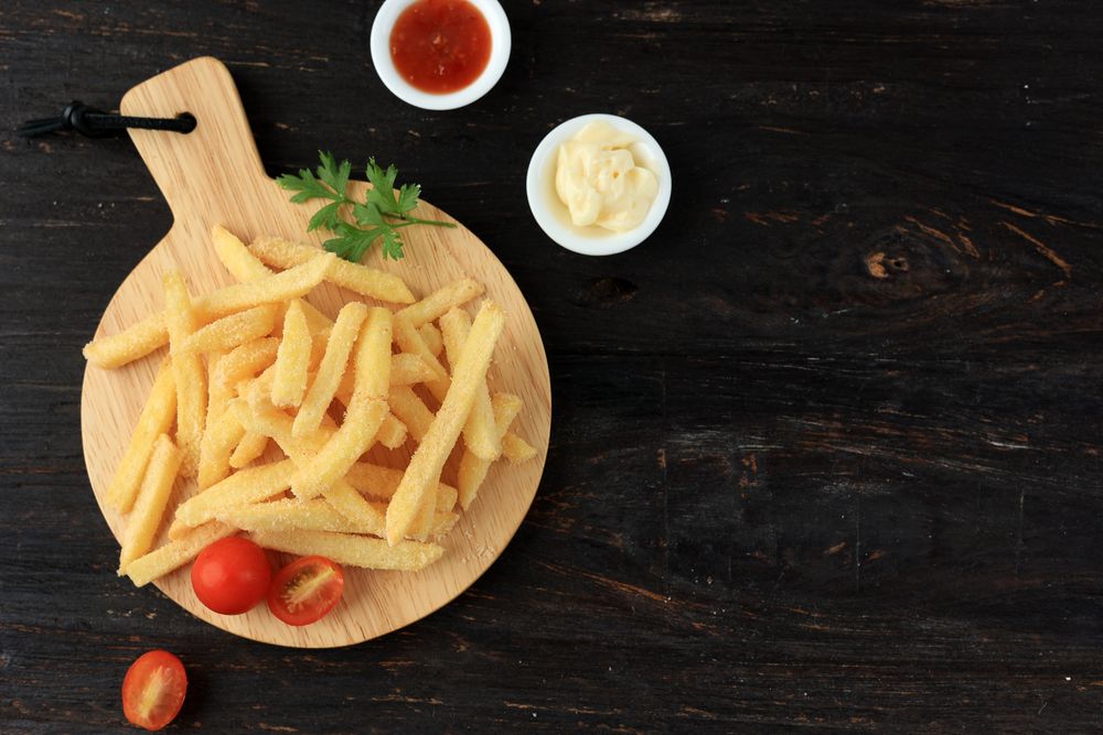 Top View Potato Shoestring French Fries Coated with Spice Powder