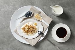Tasty and nutritious breakfast concept - muesli with yogurt