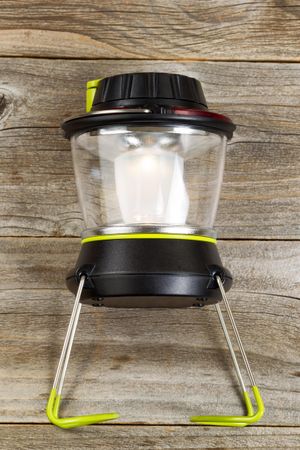 New outdoor battery lantern on rustic wood