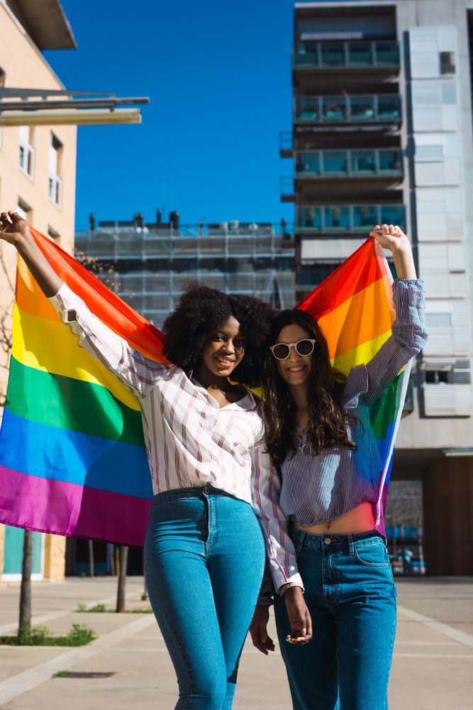 Interracial couple with LGBT flag