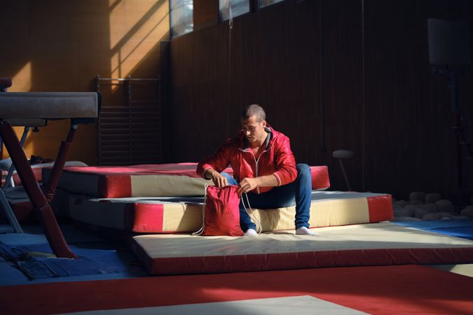 Young sports gymnast arriving at the gym to train exercises