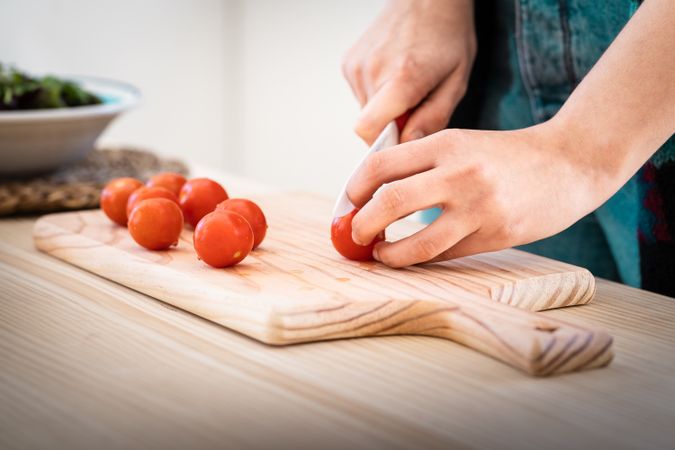 Woman preparing vegetable salad