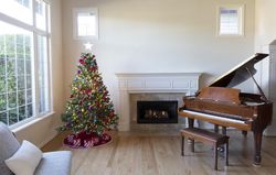 Christmas tree decorated in home during day time