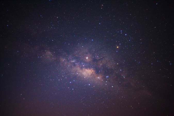 Milky way galaxy with stars and space dust in the universe, Long exposure photograph, with grain.