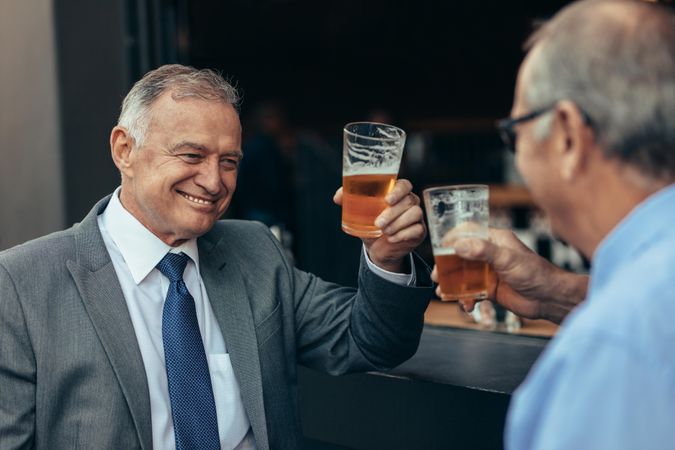 Businessmen having drinks after work at a bar