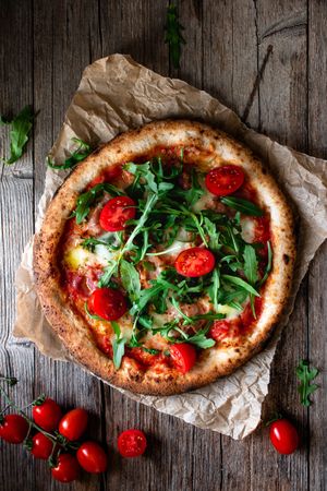 Appetizing pizza placed on wooden table