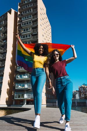 Lesbian couple with LGBTQIA flag