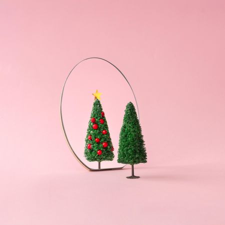 Christmas tree with mirror on pastel pink background