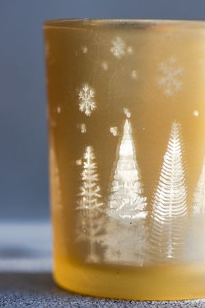 Christmas candle glass in sunny day