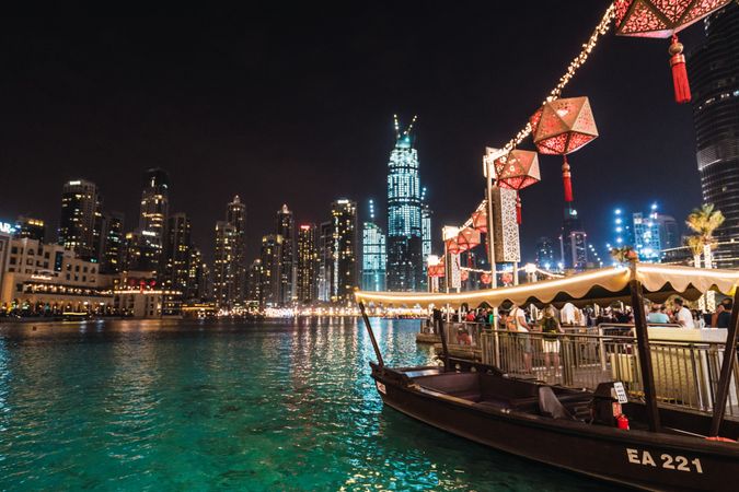 Boat and embankment in night metropolis