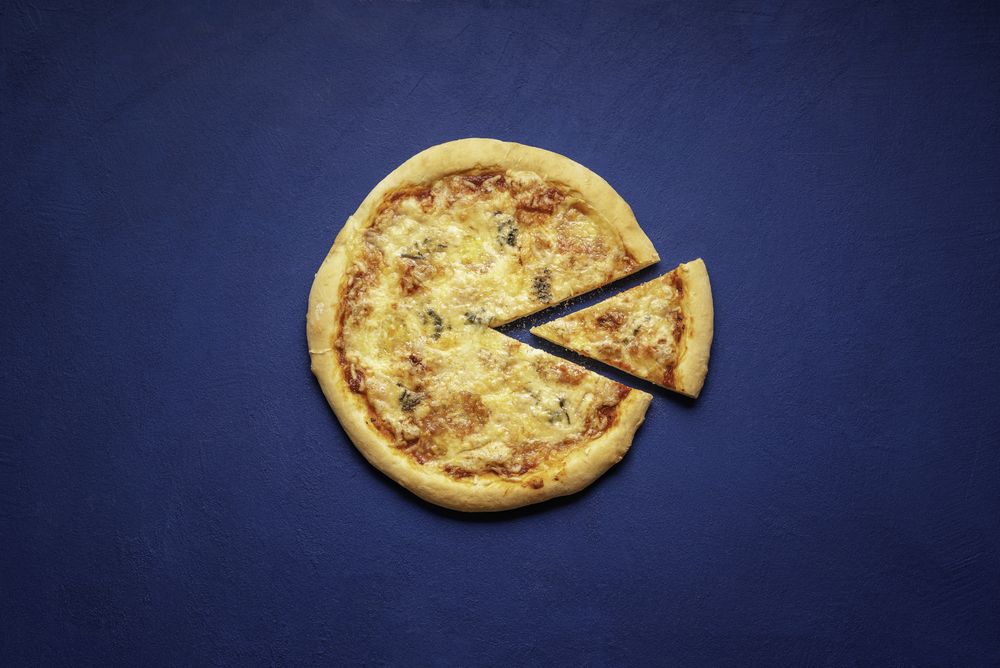 Four cheese pizza on classic blue table