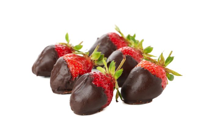 Chocolate fondue. Strawberry in chocolate isolated on plain background