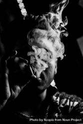 Grayscale photo of man smoking 5ax780