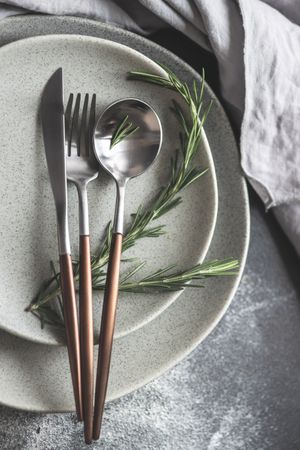 Table setting with fresh rosemary