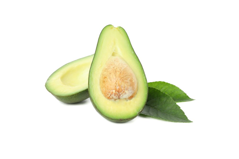Ripe avocado halves isolated on blank background