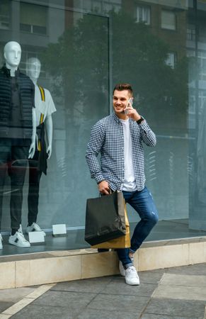 Young man with shopping bags