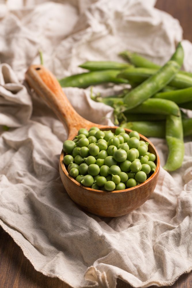 Peas in a wooden scoop