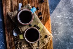 Top view of two cups of coffee with copy space