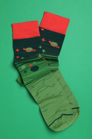 Casual clothes and wearing concept - socks, clothes for foot