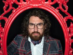 Portrait of imposing man in red art frame