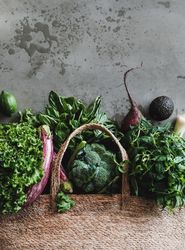 Jute bag with fresh produce, top view, vertical composition, copy space