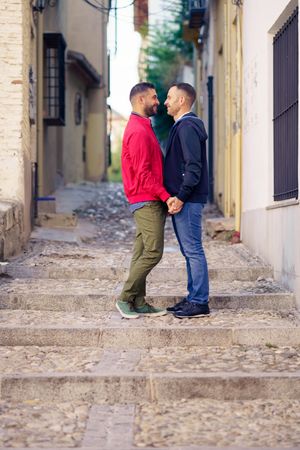 Male couple having romantic moment in European city