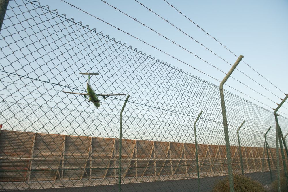 Plane behind security fence