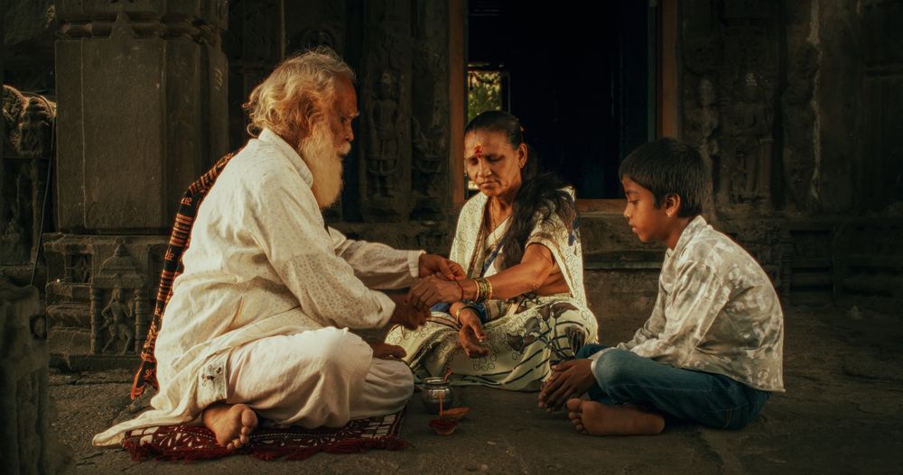 Authentic Footage of Hindu Priest Putting a Tilaka on Male Kid in a Temple.