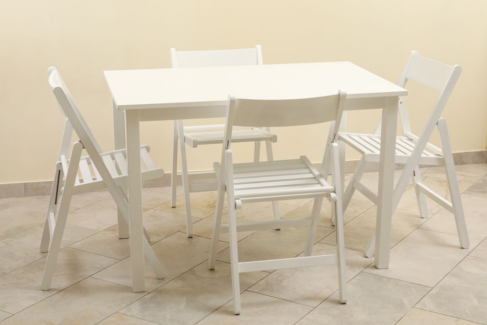table and folding chairs in kitchen room