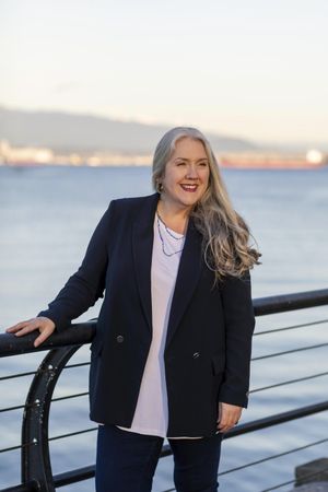 Happy professional woman with long gray hair